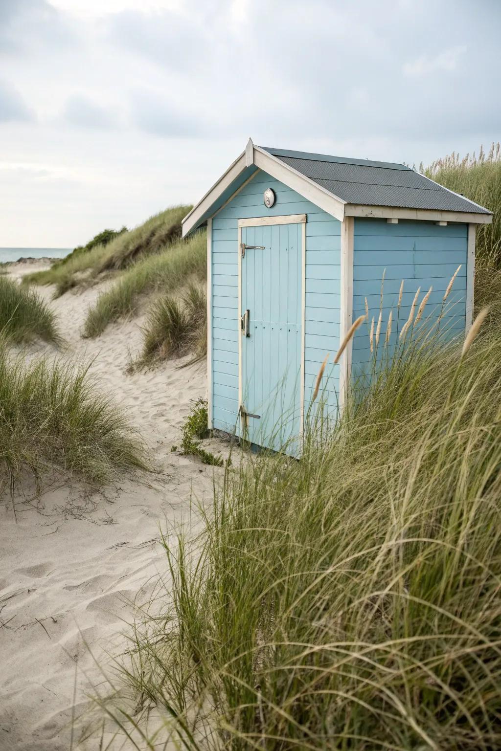 A beach shed painted in a soothing nautical color palette for a fresh coastal look.