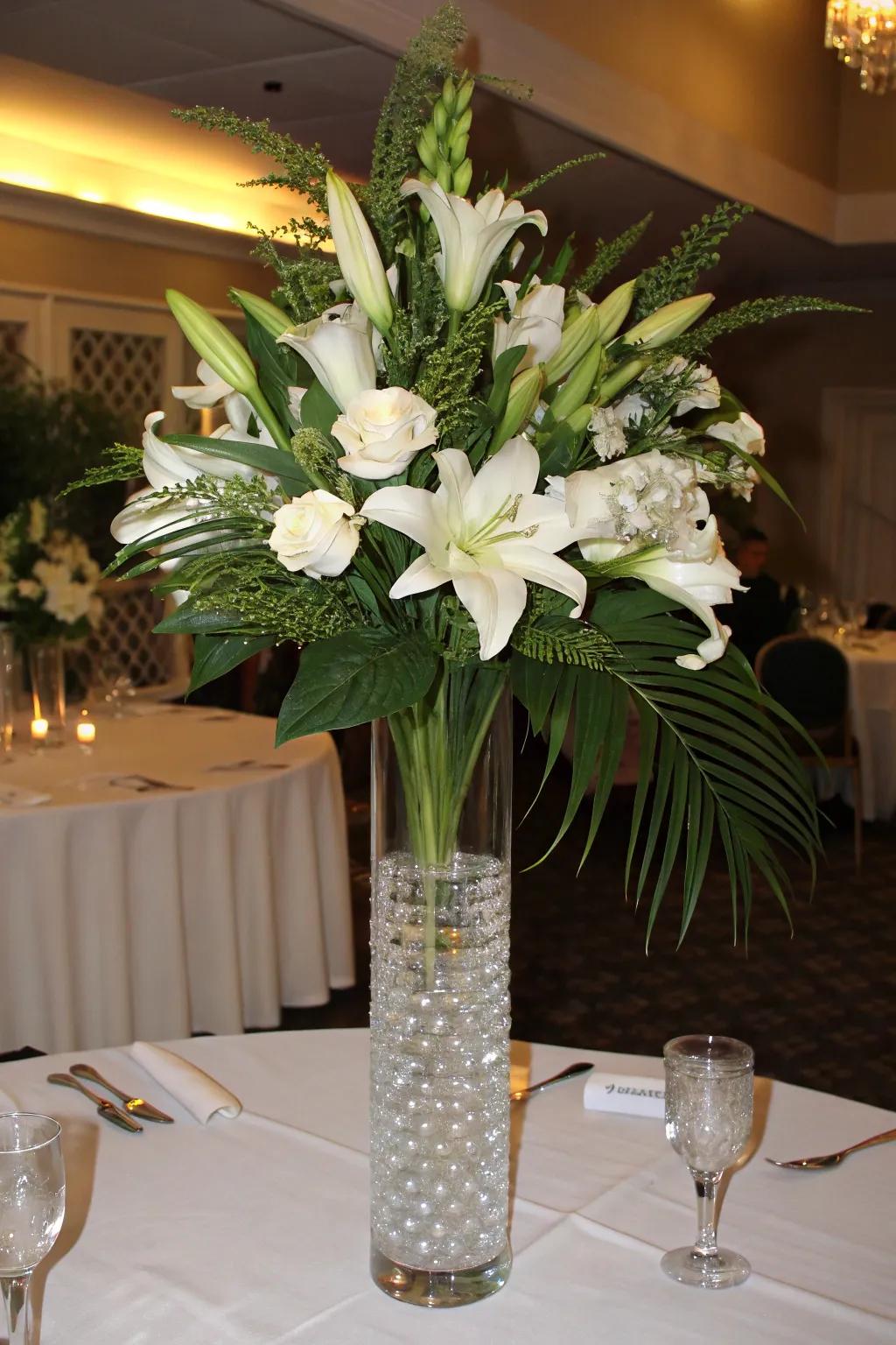 Classic floral arrangement with tall white lilies and lush greenery.