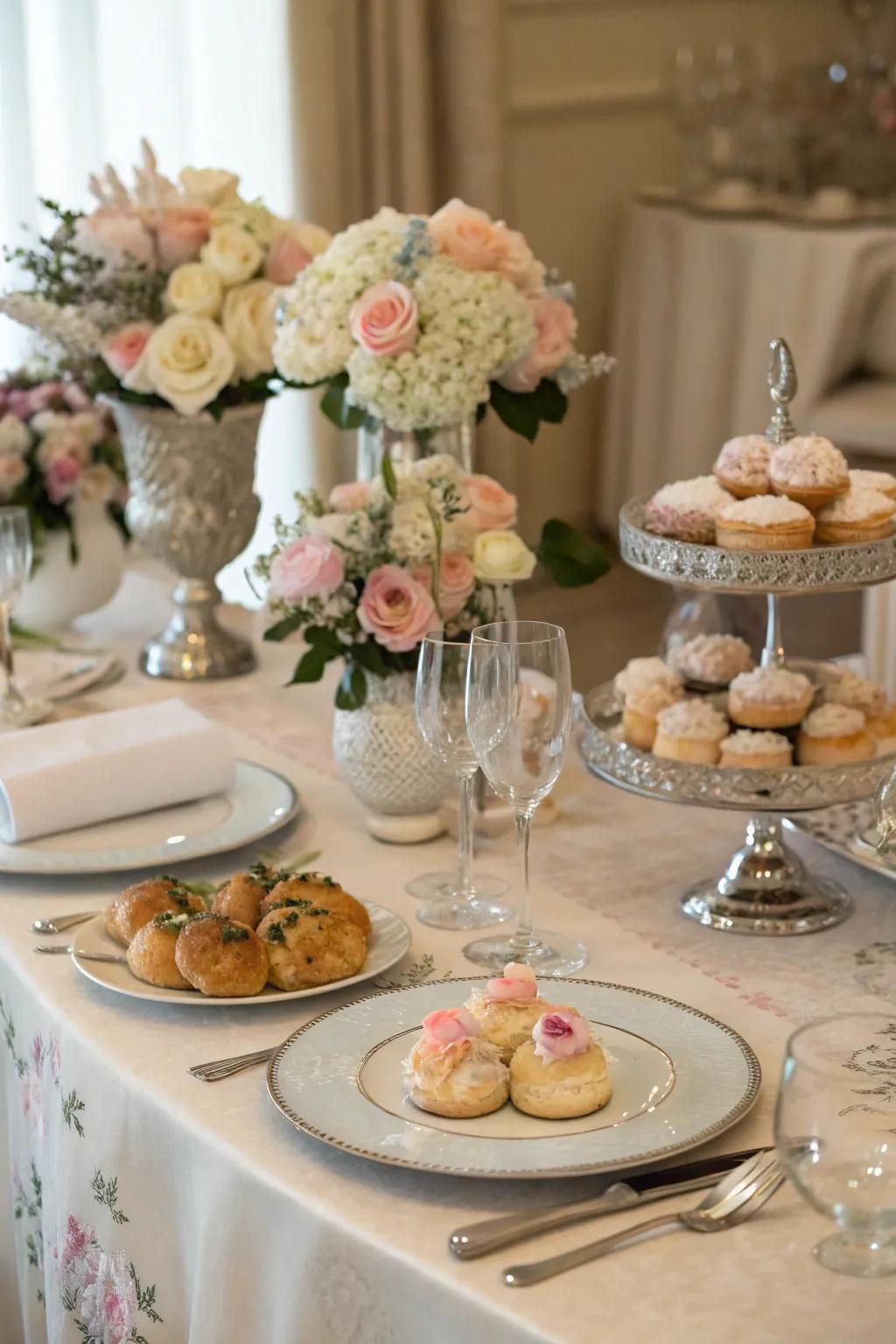 An elegantly arranged table with fresh flowers and a variety of breakfast options.