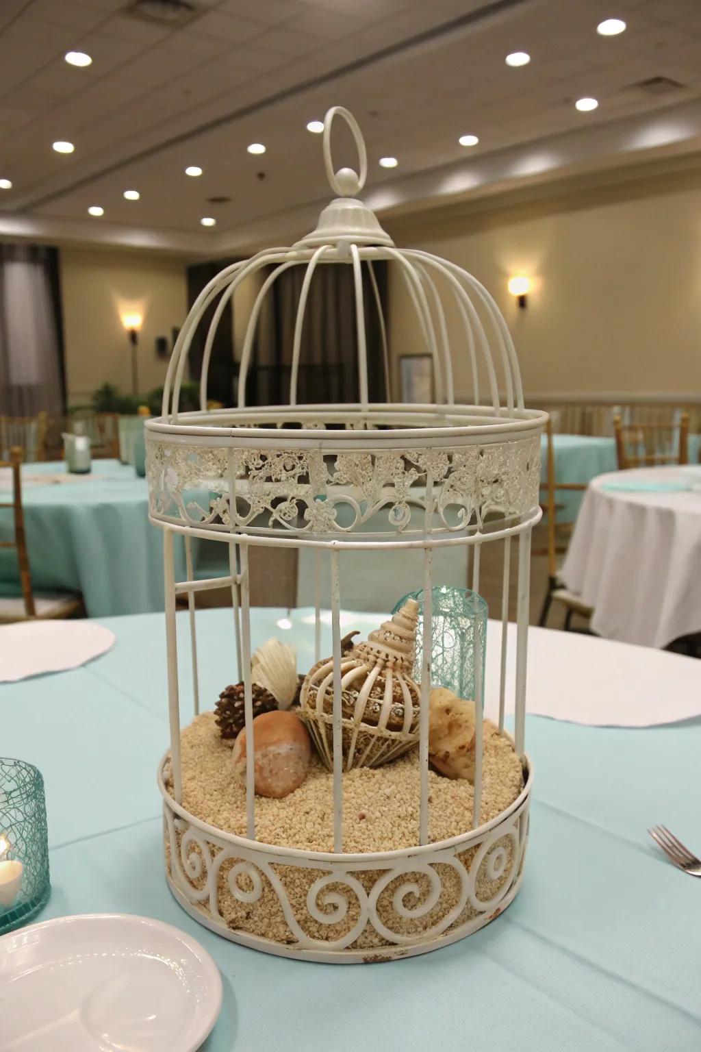 A coastal-themed bird cage centerpiece with beachy elements.