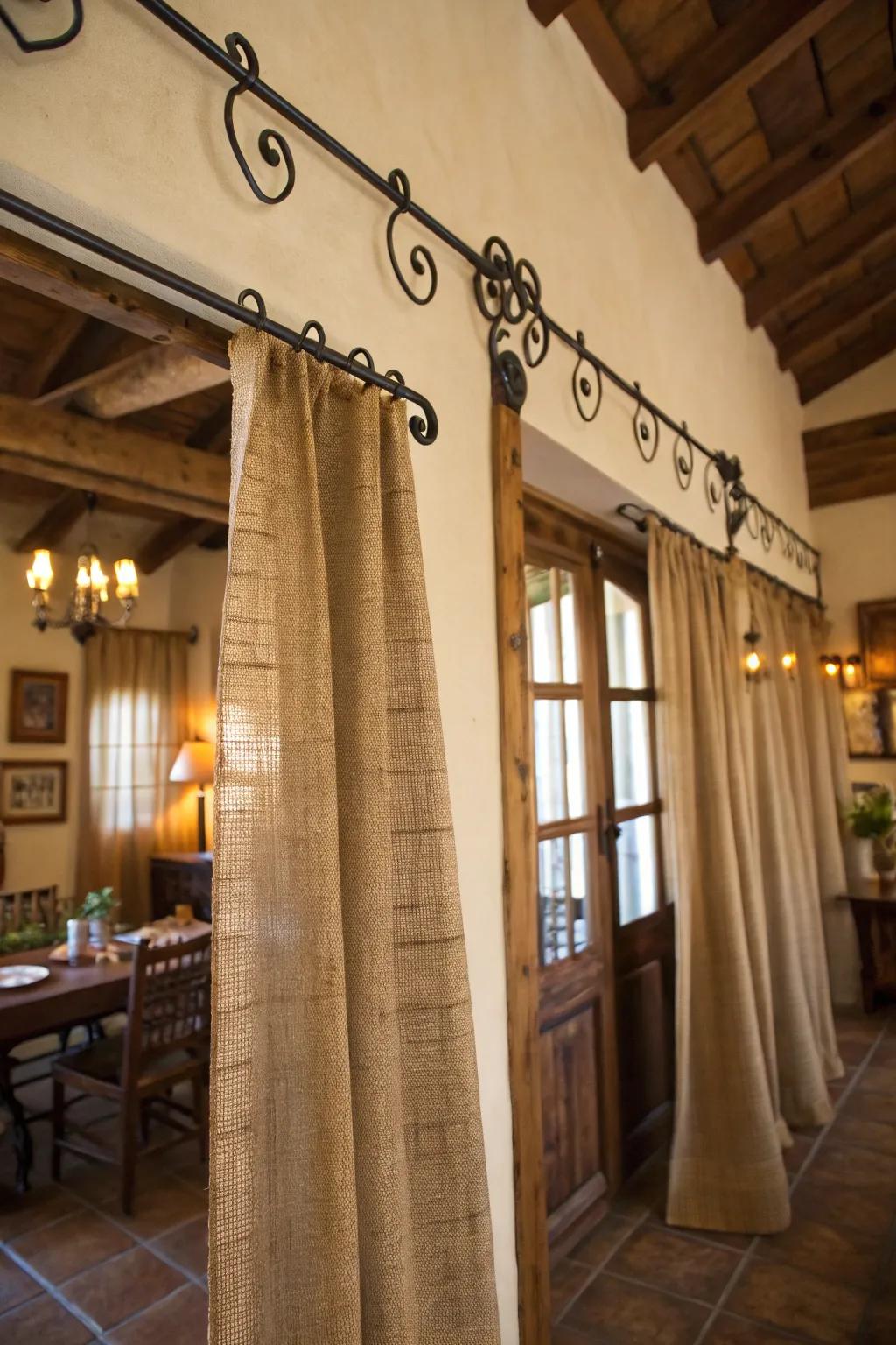 Rustic elegance with burlap curtains and wrought iron rods.