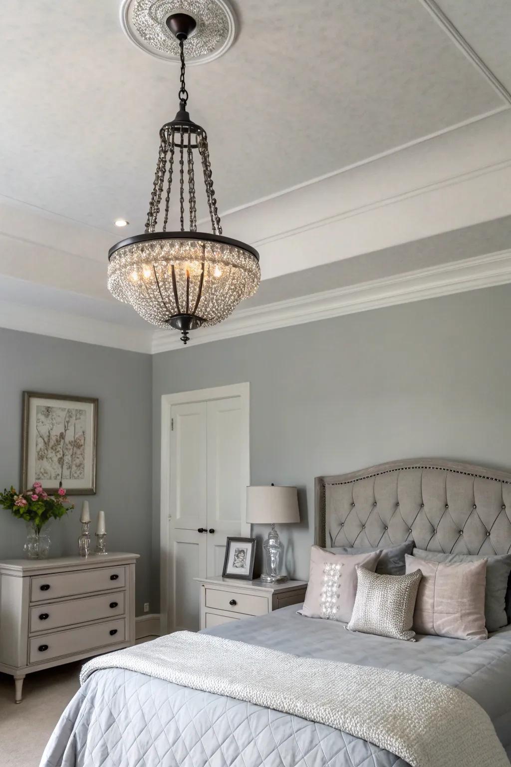 Lighting that doubles as art in a tranquil gray bedroom.