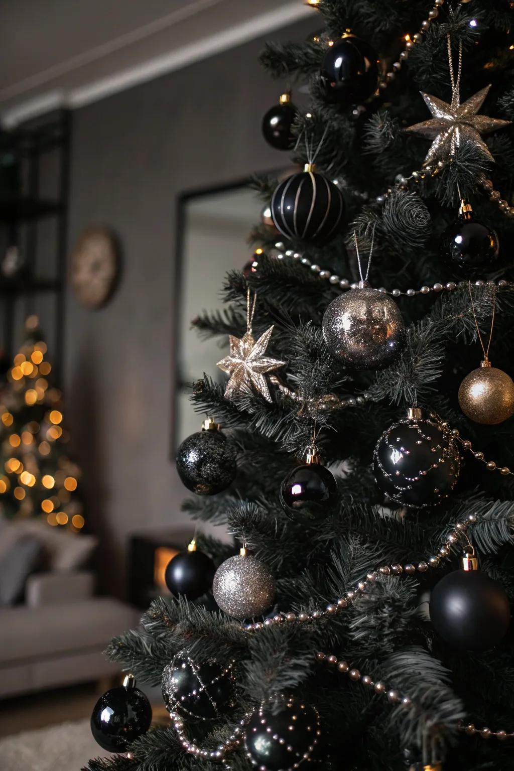 A bold glam rock-themed Christmas tree with striking black and metallic decorations.