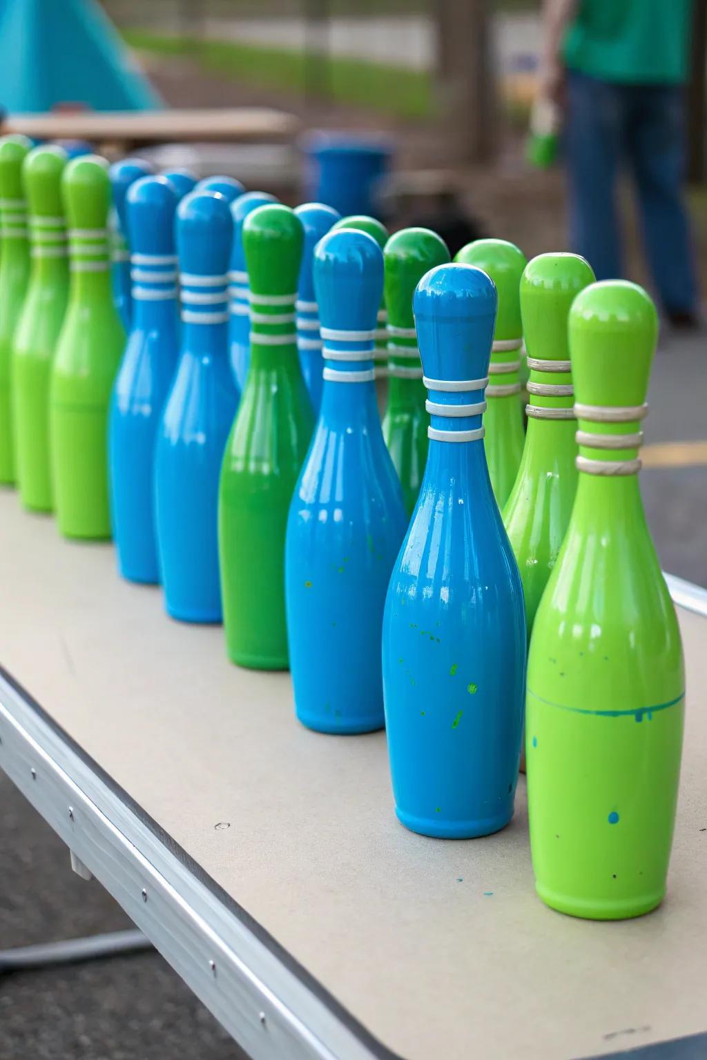 Crafty DIY spray-painted bottles for a unique bowling centerpiece.