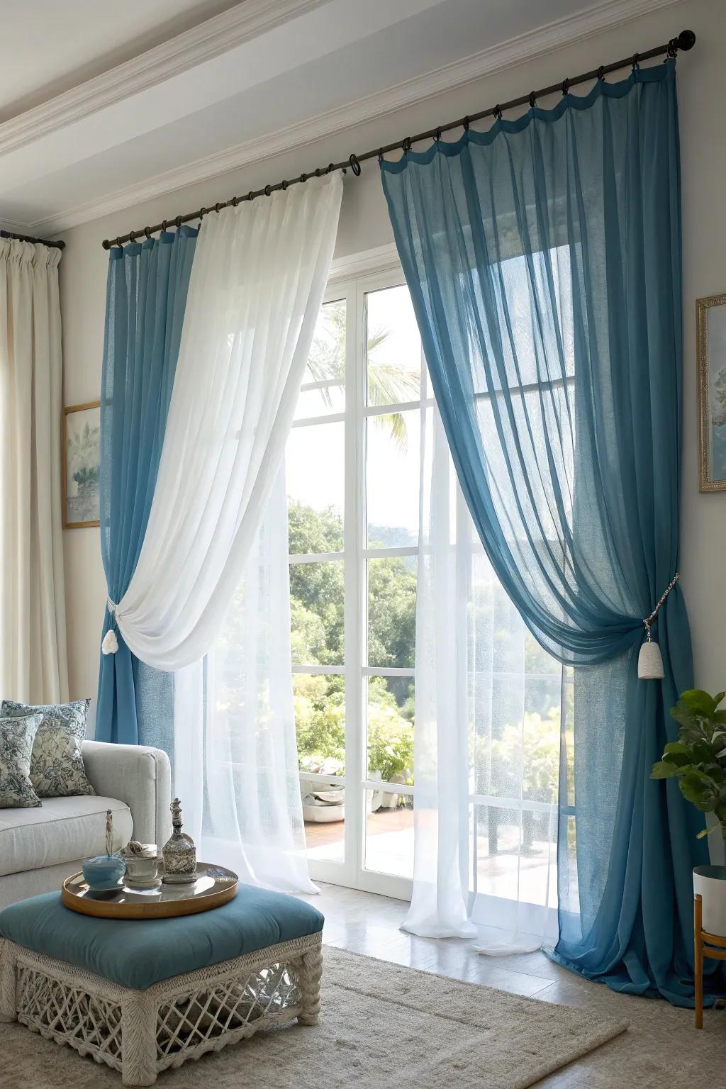 Layering blue curtains with white sheers creates a light and airy ambiance, offering versatile light control.