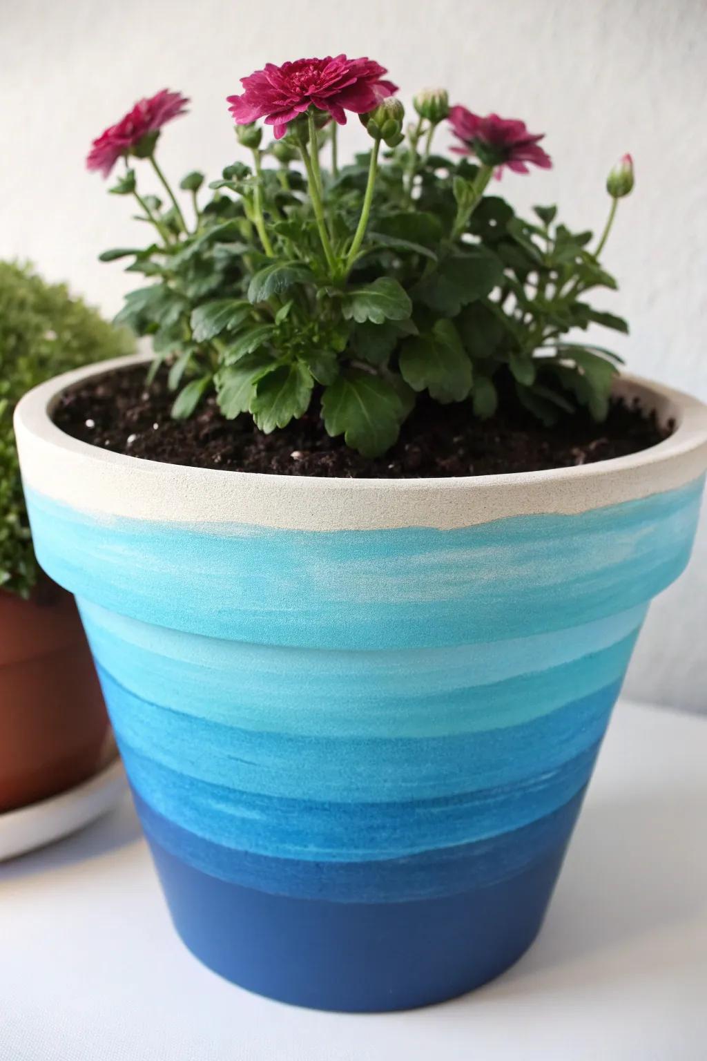 A flower pot with a stunning layered paint effect.