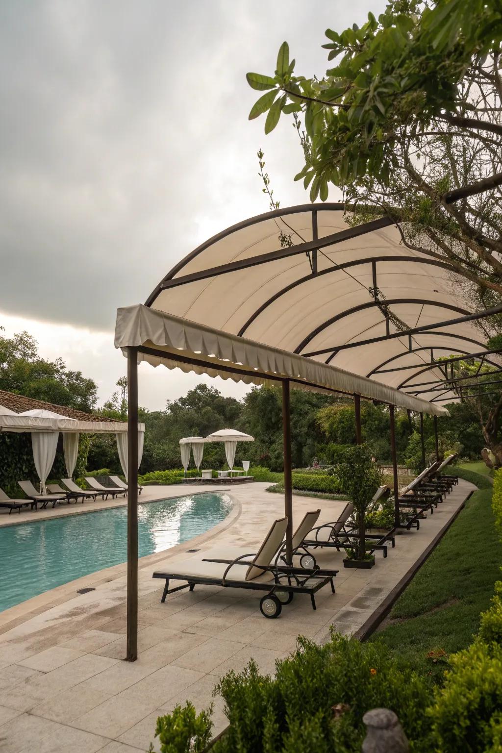 Soft curves in shade structures add harmony and flow to poolside settings.