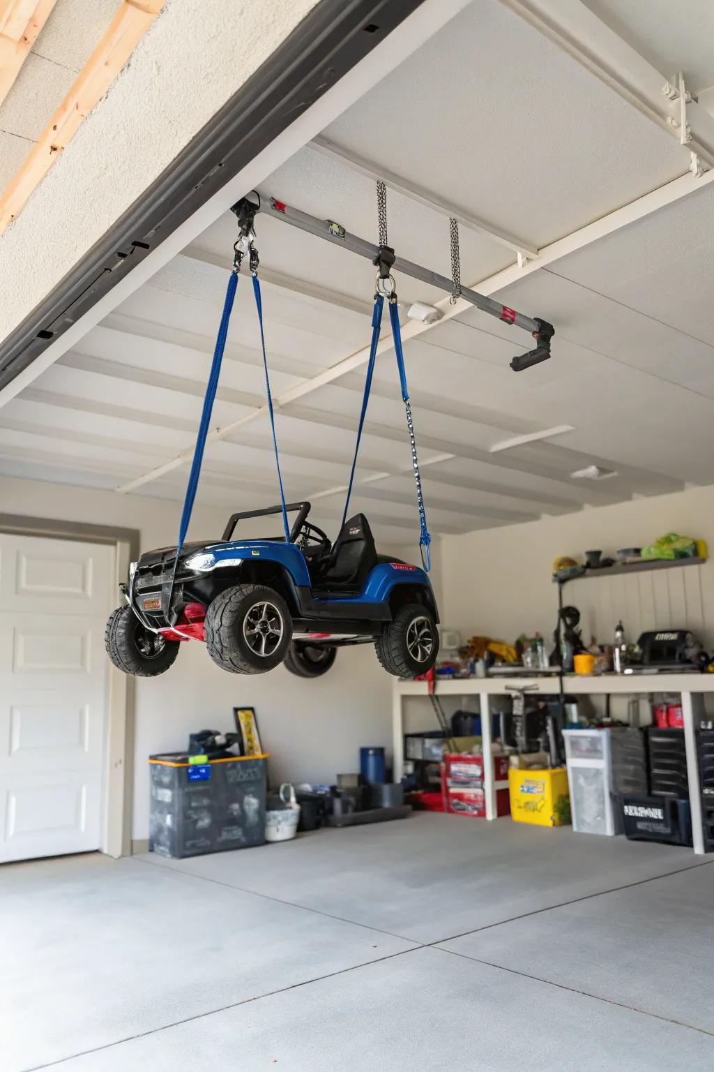 Hanging straps suspending power wheels to clear floor space.