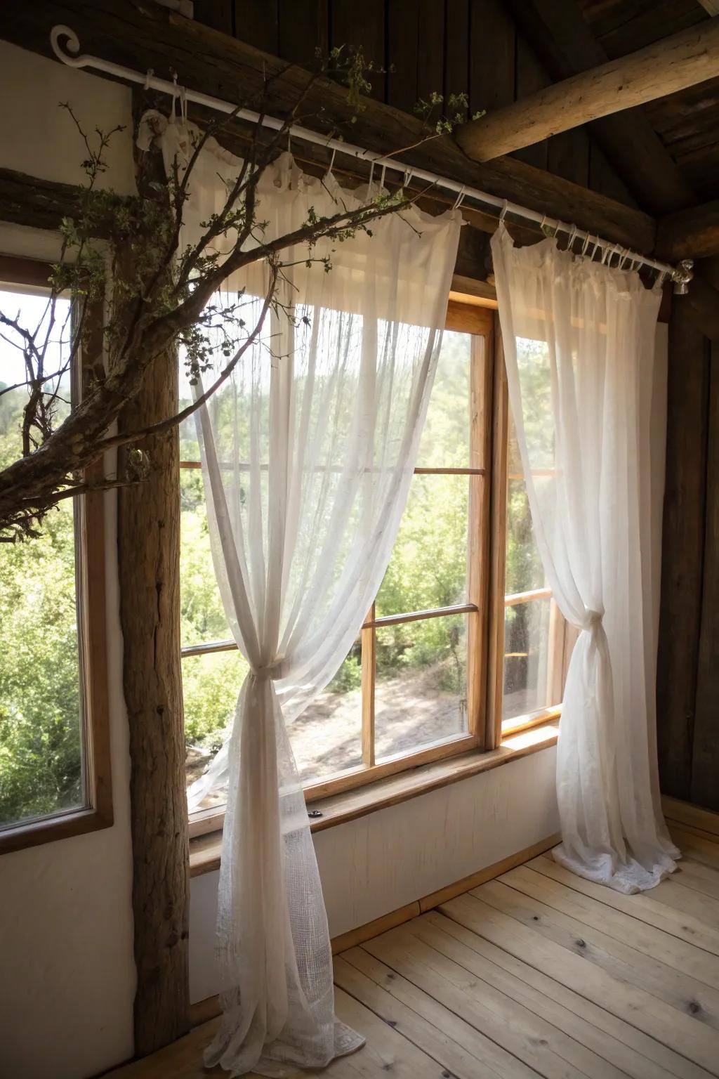 Rustic window with a branch curtain rod.