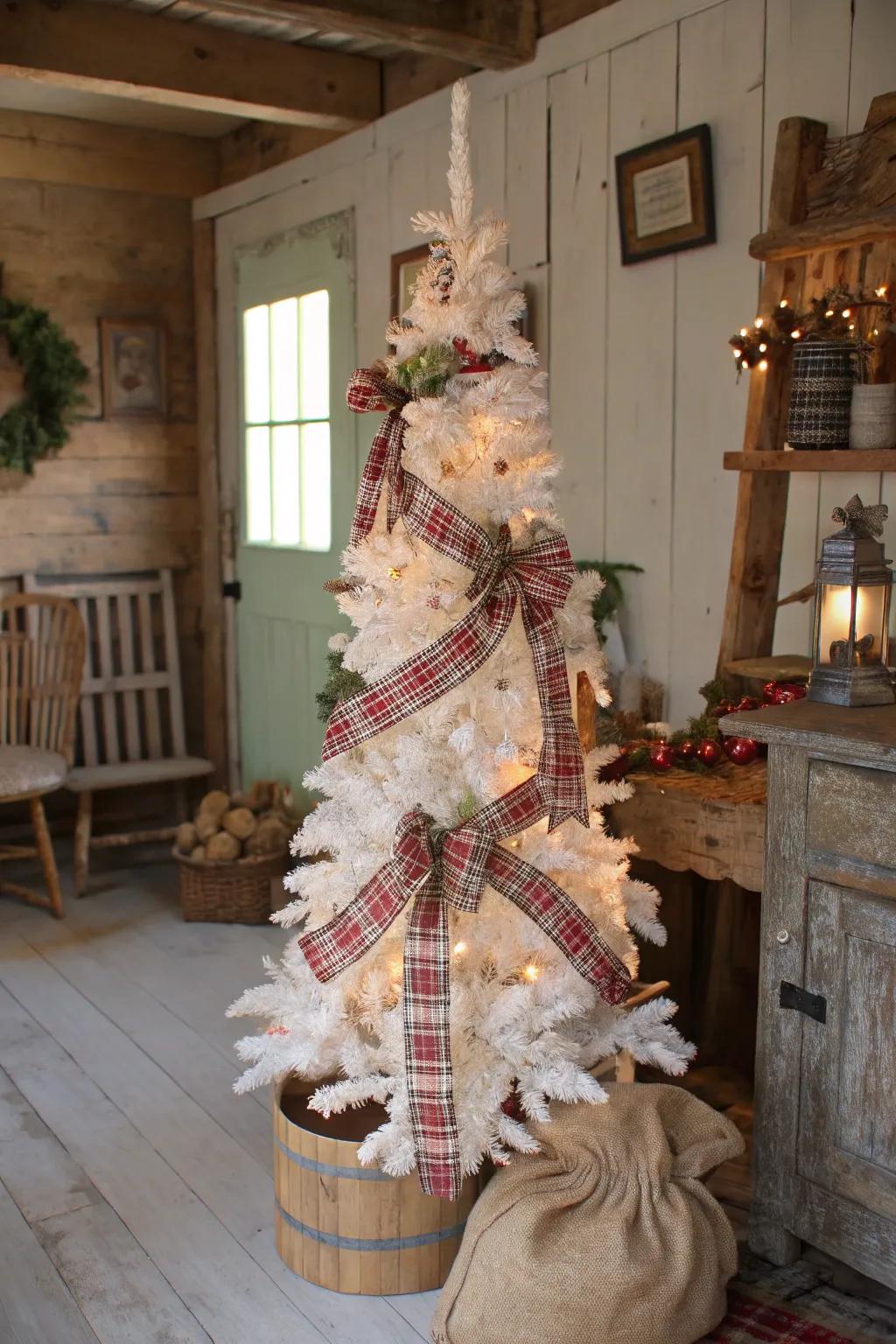 A rustic charm-themed white pencil tree with burlap and plaid.