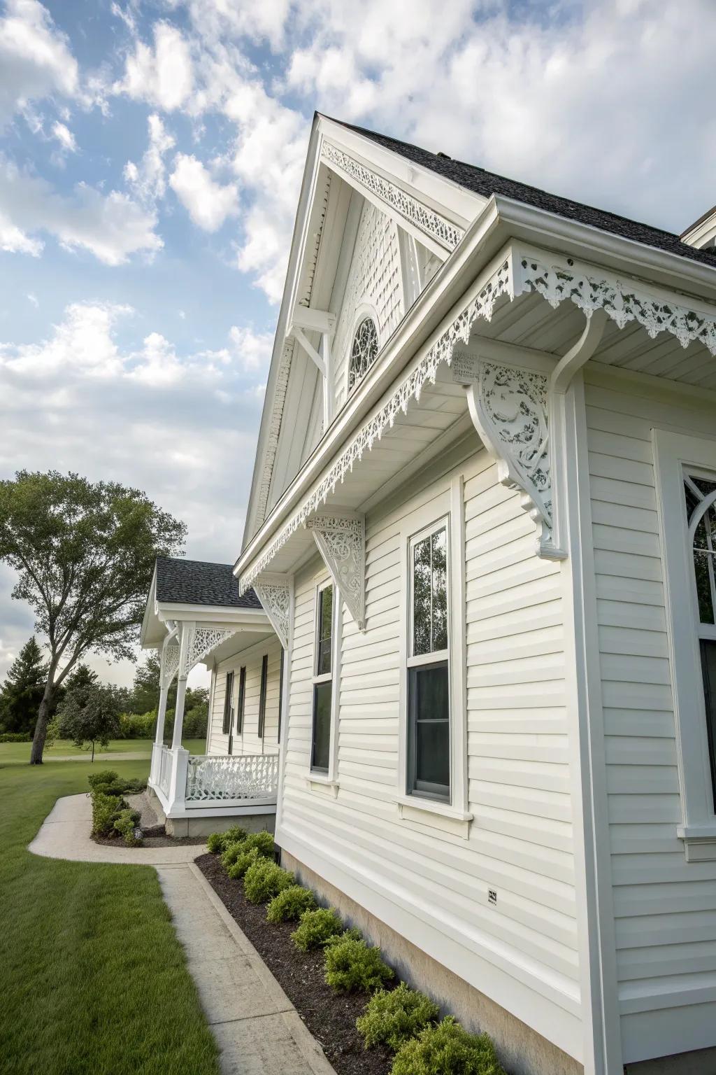 A house with white vinyl siding and elegant detailed trim.