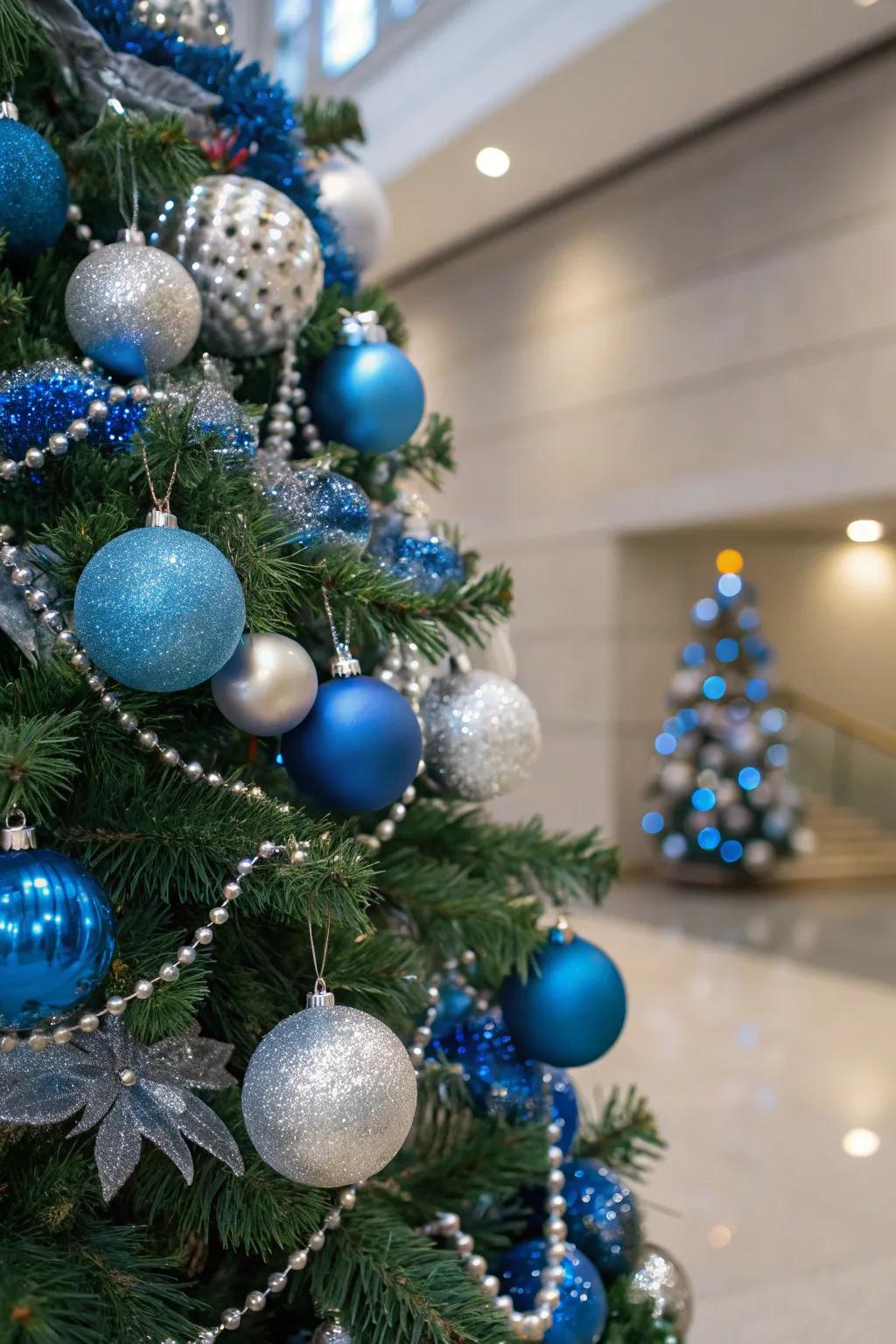 A stunning single-color themed Christmas tree featuring blue and silver decorations.