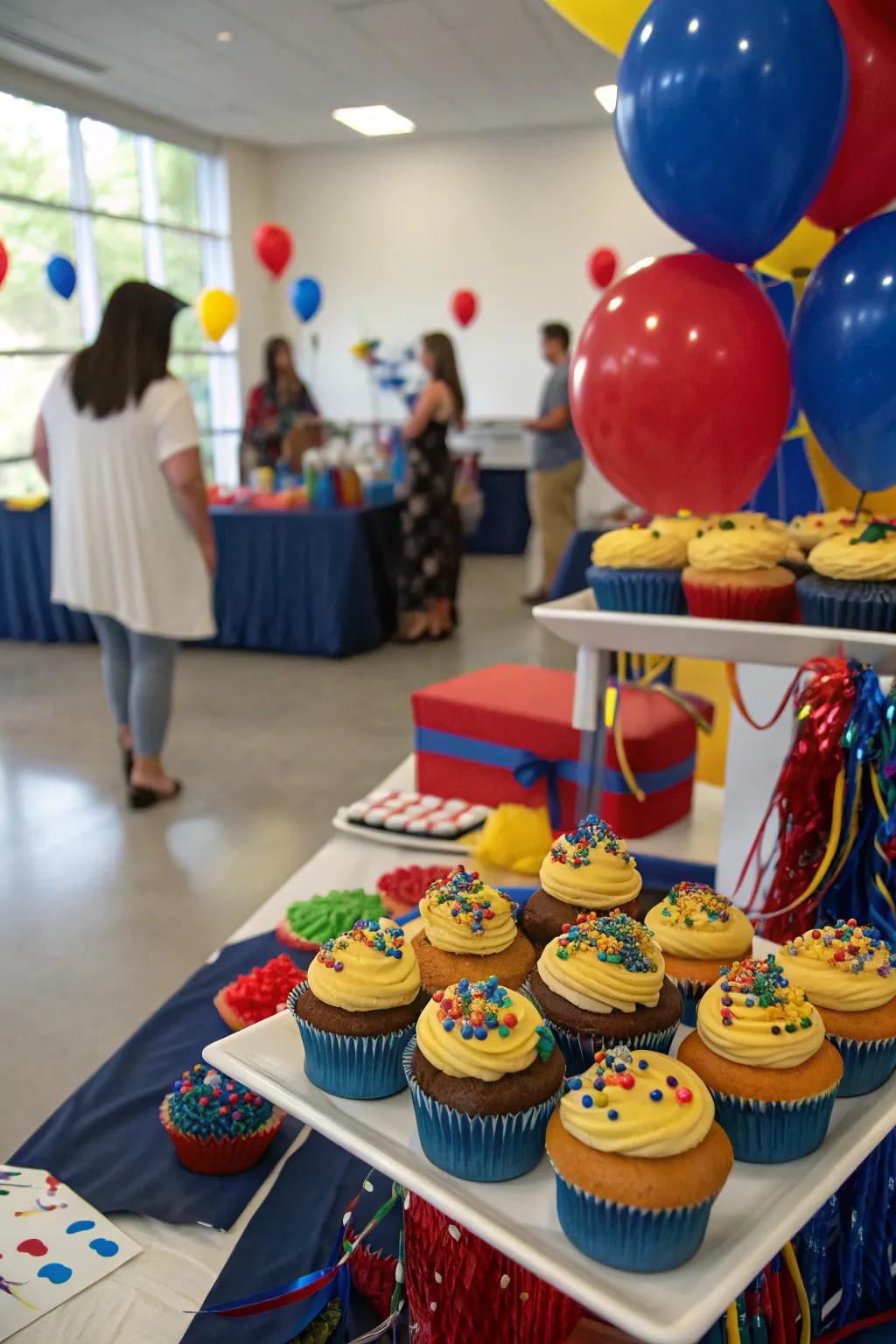 A dessert display with themed cupcakes offers a sweet treat and decor.