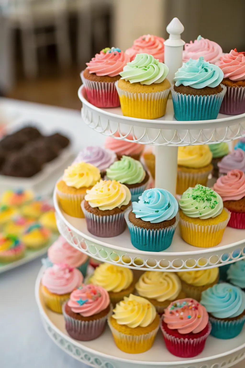 A towering display of cupcakes that adds height and color to the party.