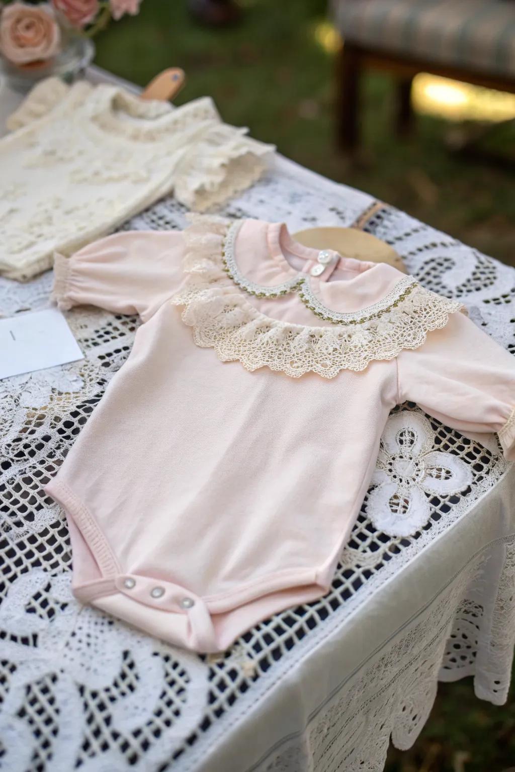 An elegant onesie featuring vintage lace accents.