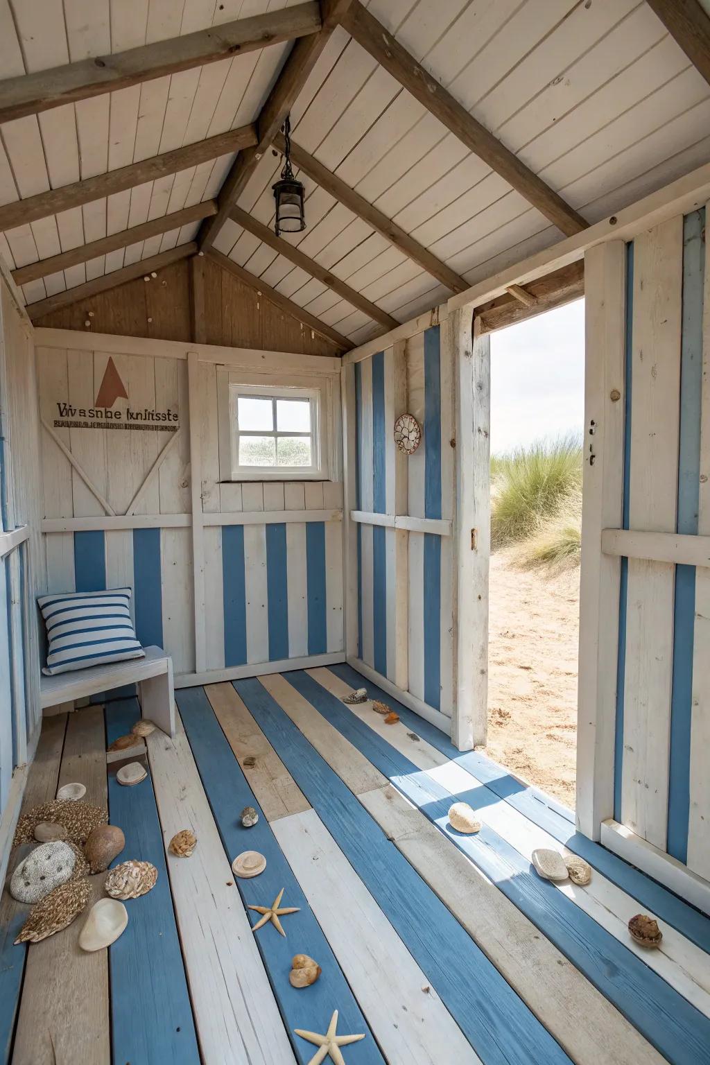 Painted floorboards in nautical stripes brighten the beach shed interior.