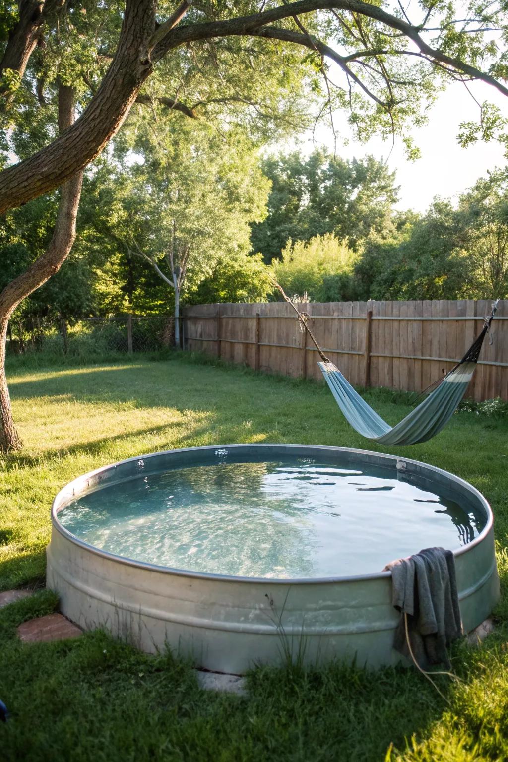 A hammock complements the relaxation vibe of a stock tank pool.