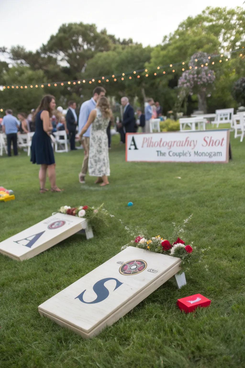 Personalized lawn games at a wedding, featuring the couple's monogram and themed colors.