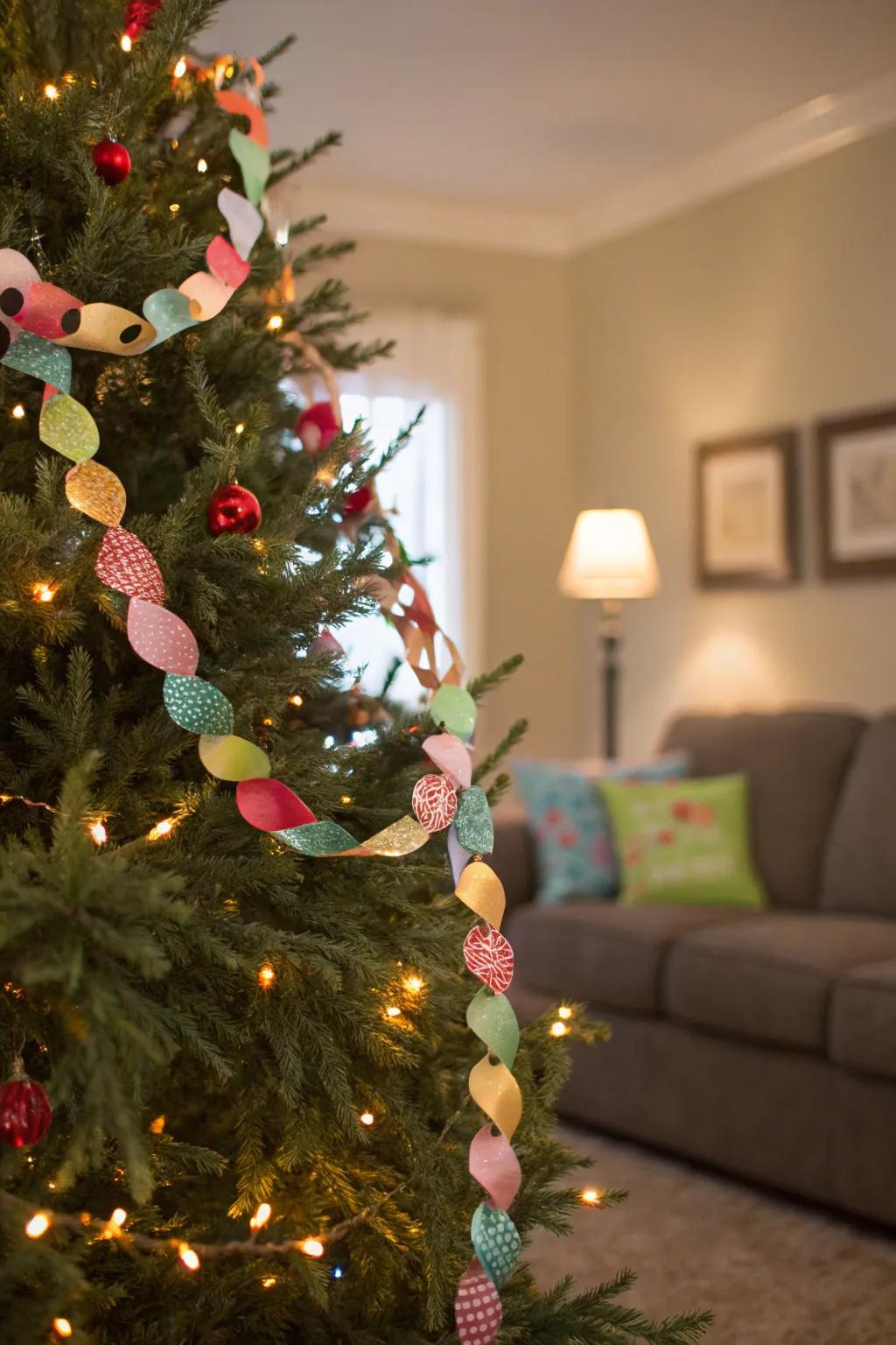 A Christmas tree decorated with a vibrant paper chain garland.