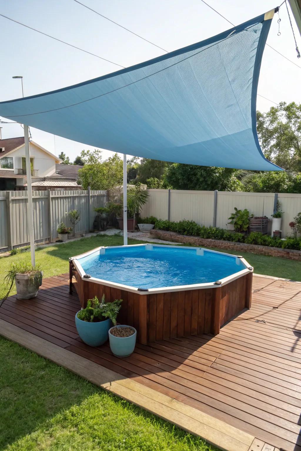 A modern sun sail offering stylish shade to an above-ground pool area.