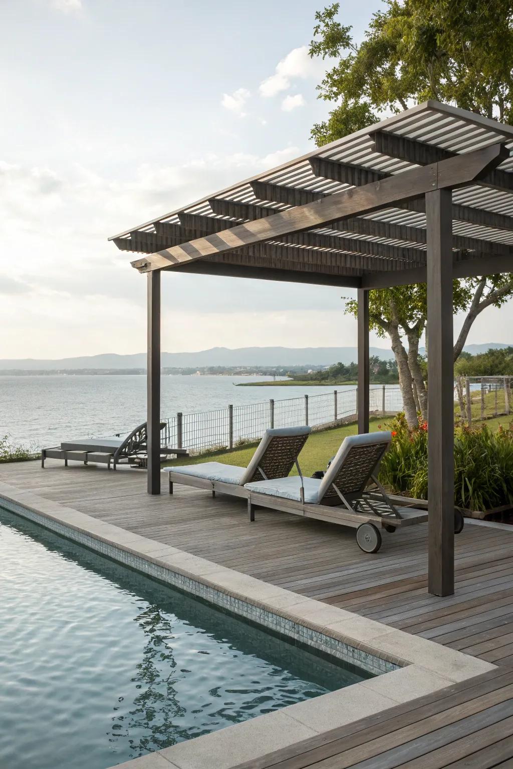 A poolside deck with a pergola, offering a relaxing retreat.