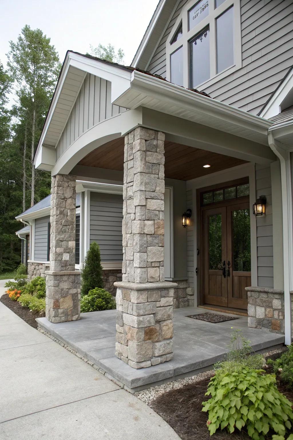 Grand entrance with grey tones and stone pillars.