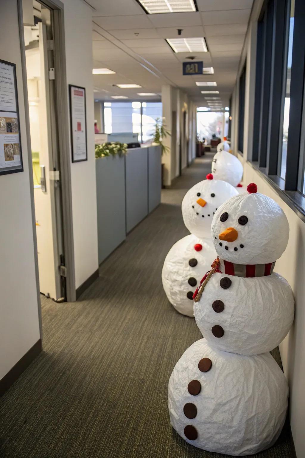 Snowman figures bring a frosty charm to the office halls.