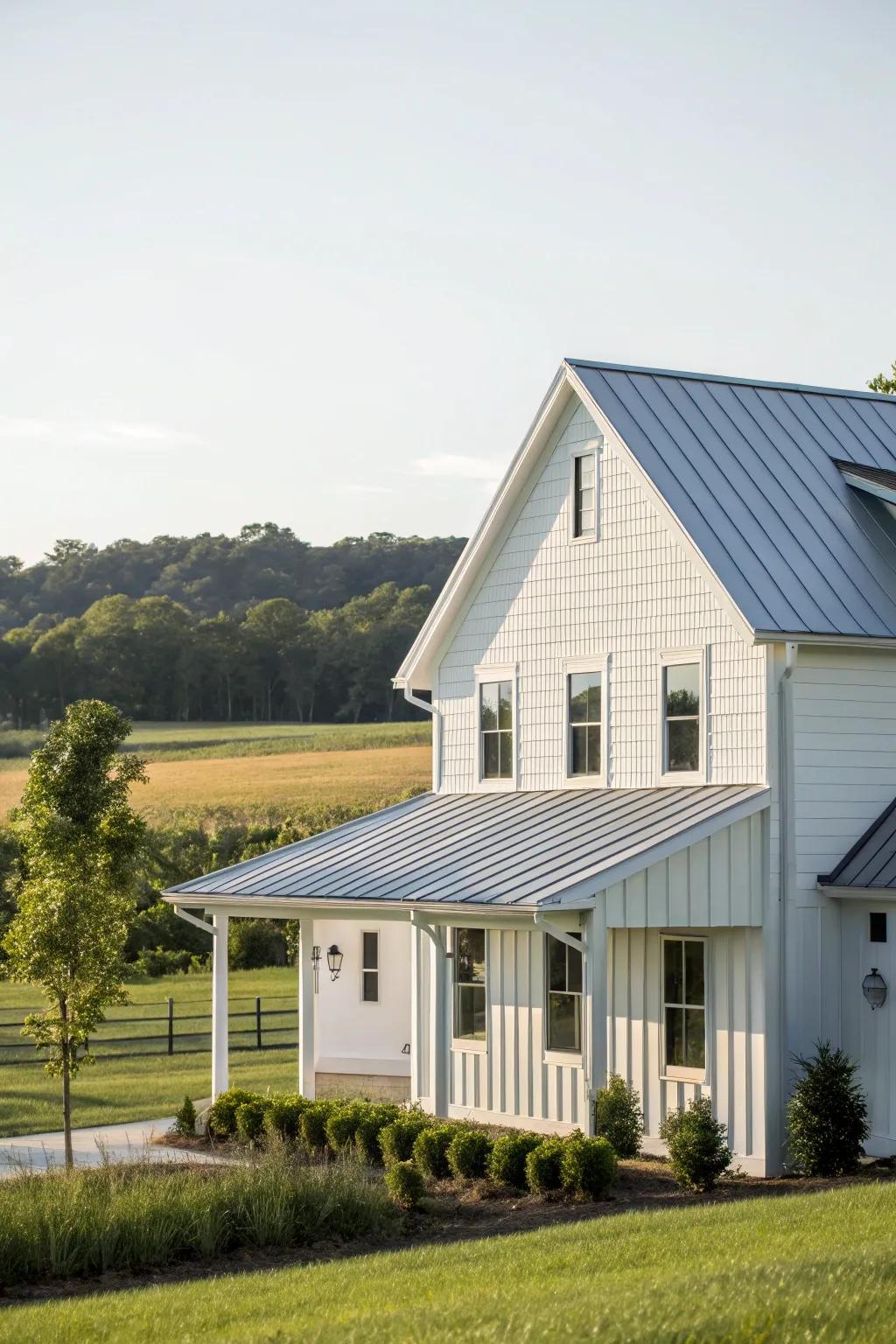 A modern farmhouse with white vinyl siding and a sleek metal roof.