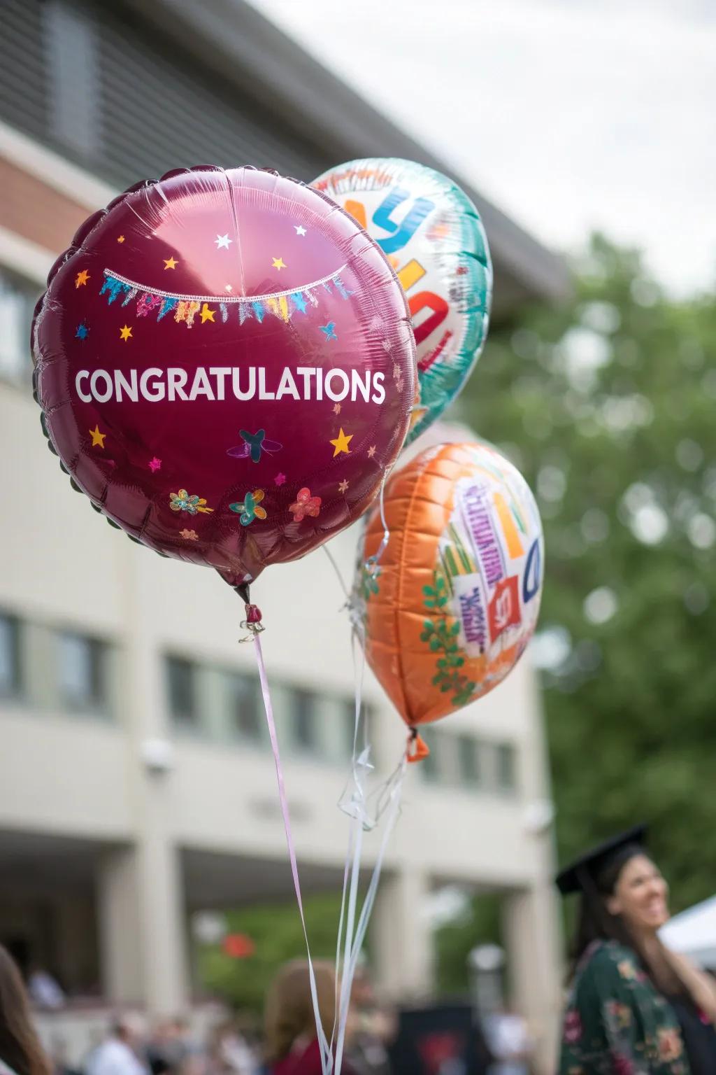 Personalized balloons displaying the graduate's name and special messages.