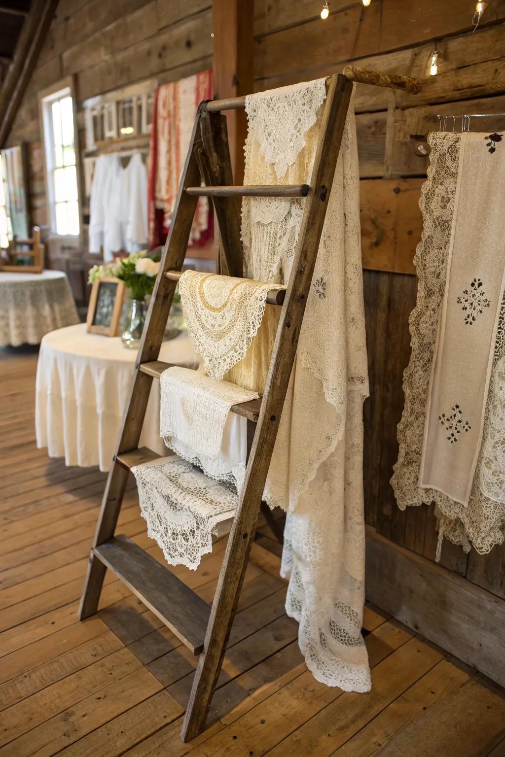 Vintage ladder used as a display rack for lace textiles