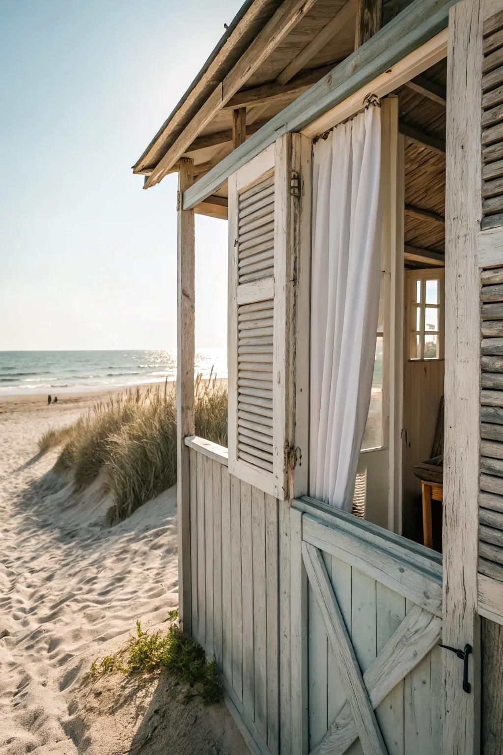 Open-air shutters invite a coastal breeze into the beach shed.