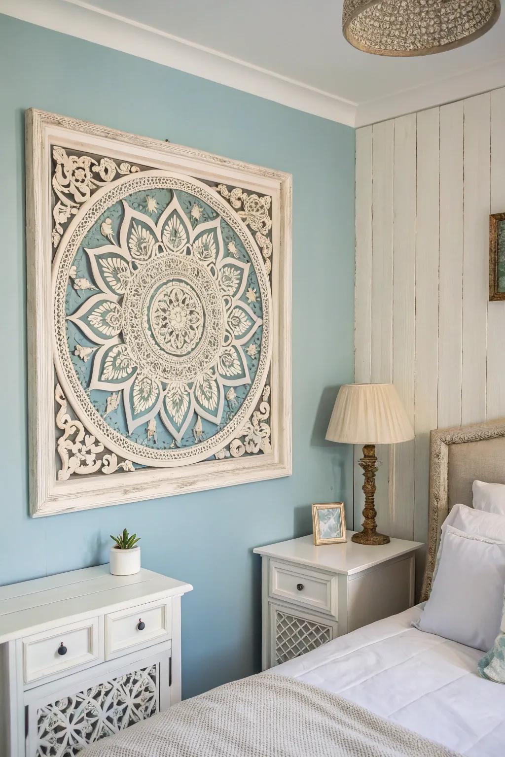 Wall art enhances the visual appeal of a blue and white themed bedroom.