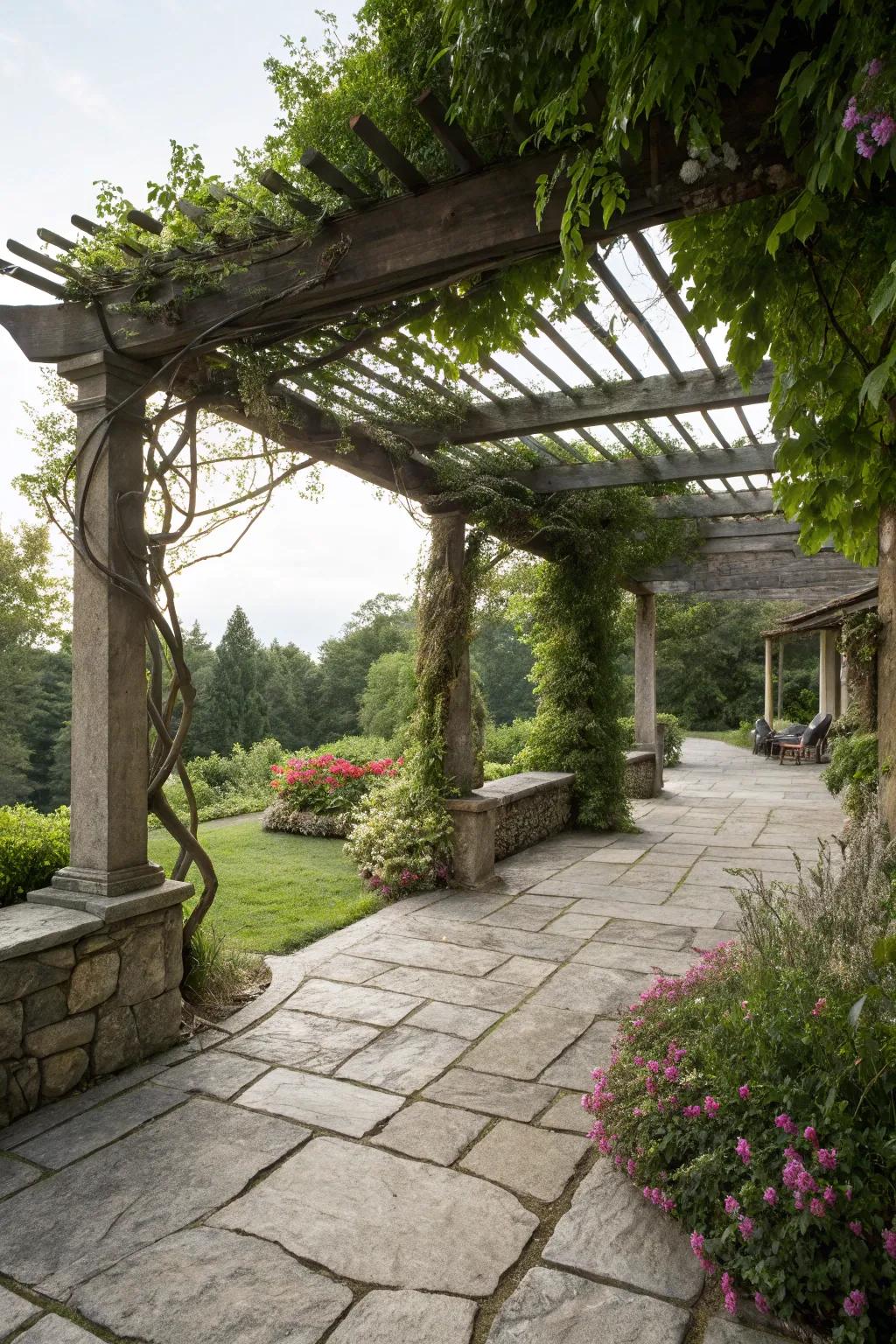 A stone patio complemented by a pergola with lush greenery.