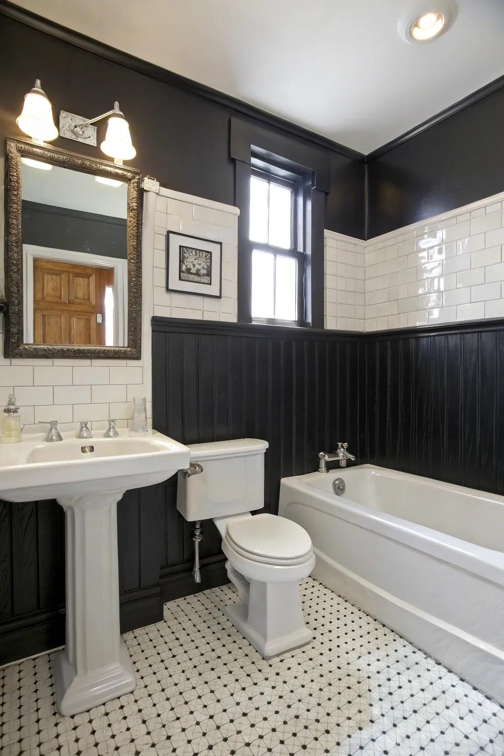 Chic bathroom featuring black wainscoting.