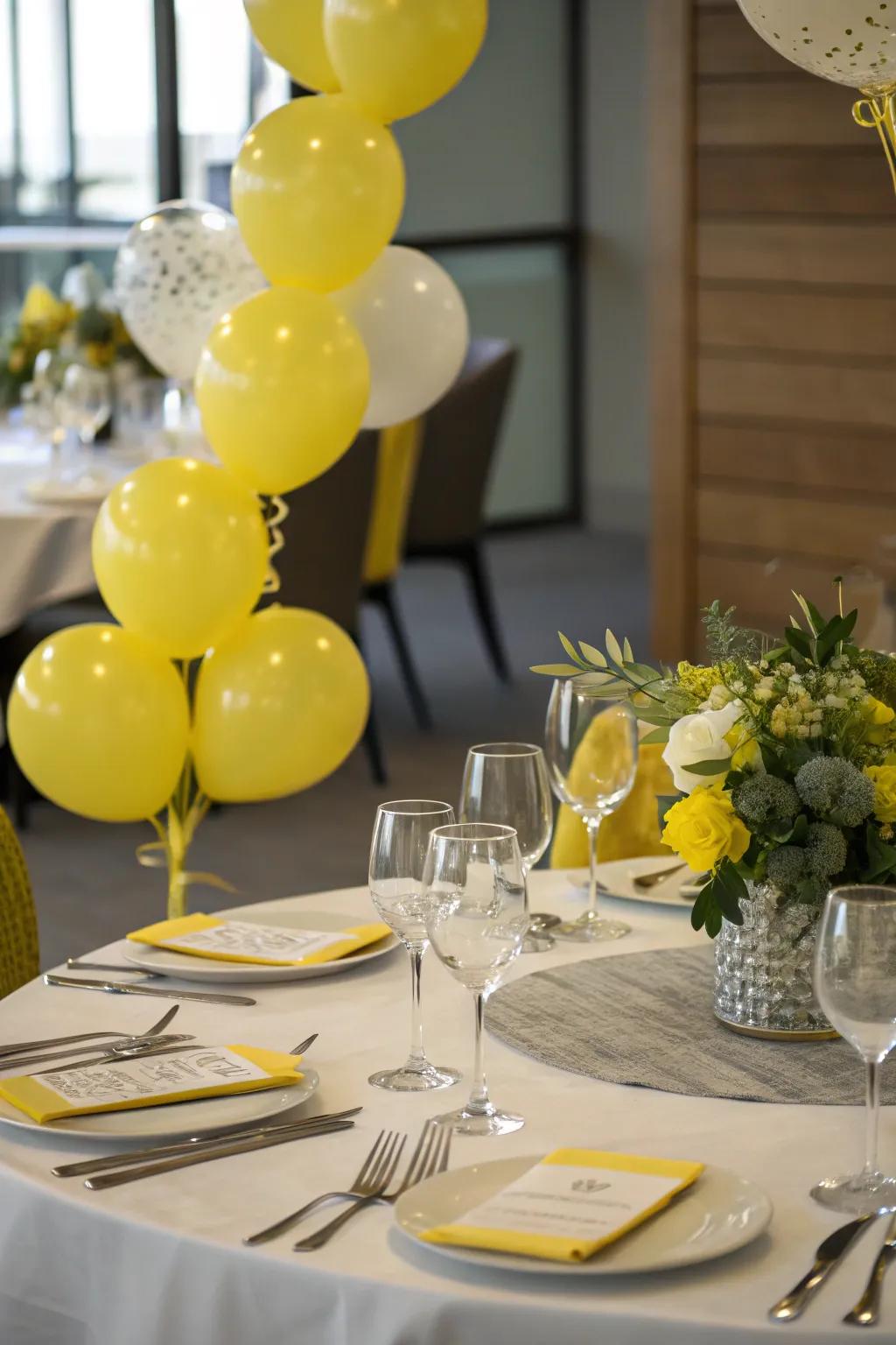 Festive tablescape with yellow balloon decor.