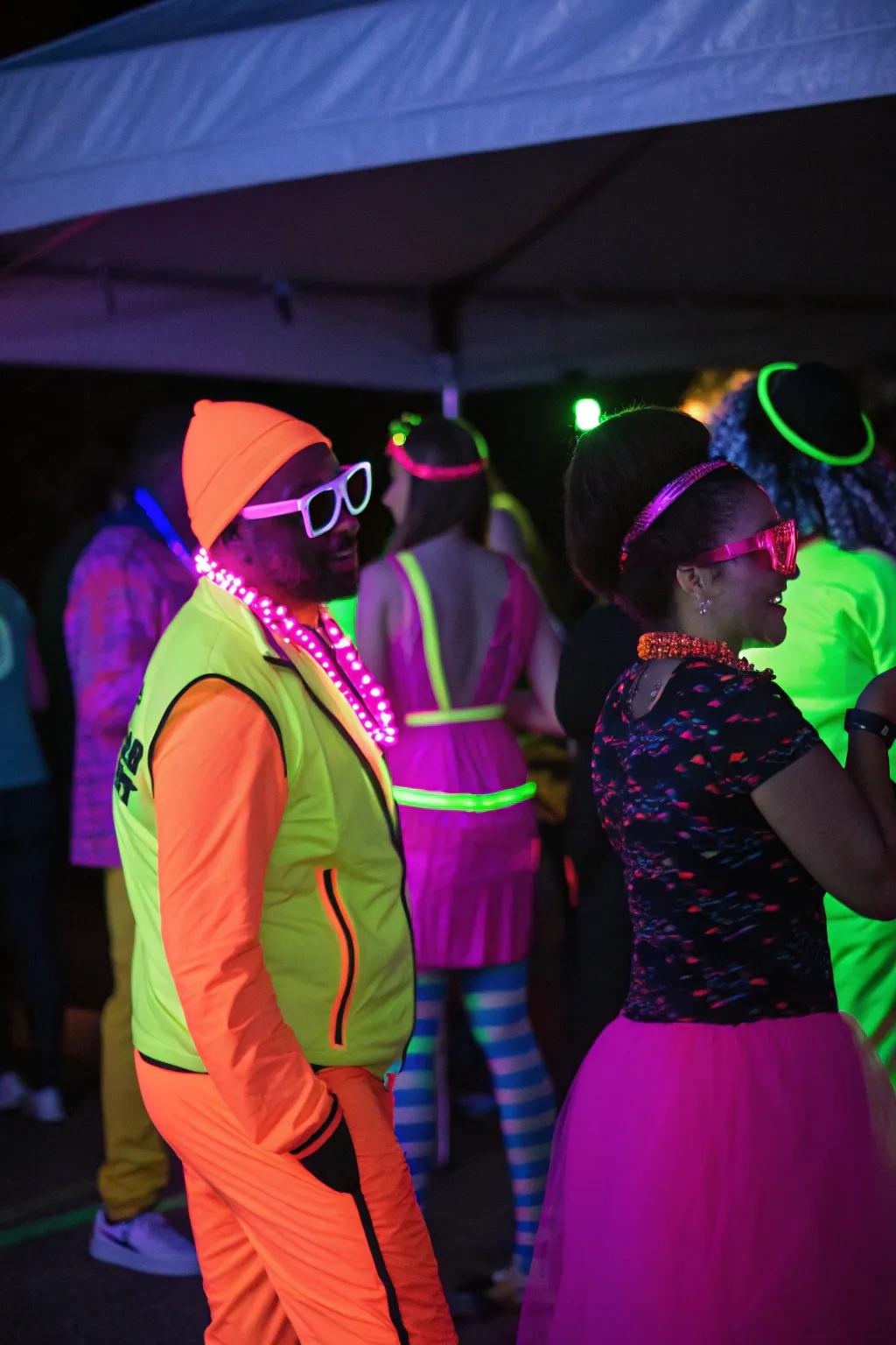 Guests in neon costumes and accessories, glowing and adding energy to the party.