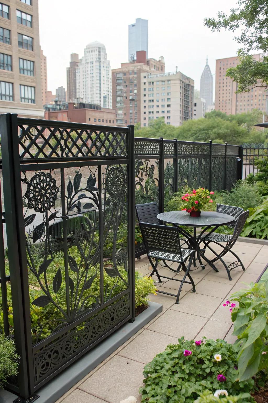 Artistic cutouts on a metal fence add a unique touch to this urban garden.