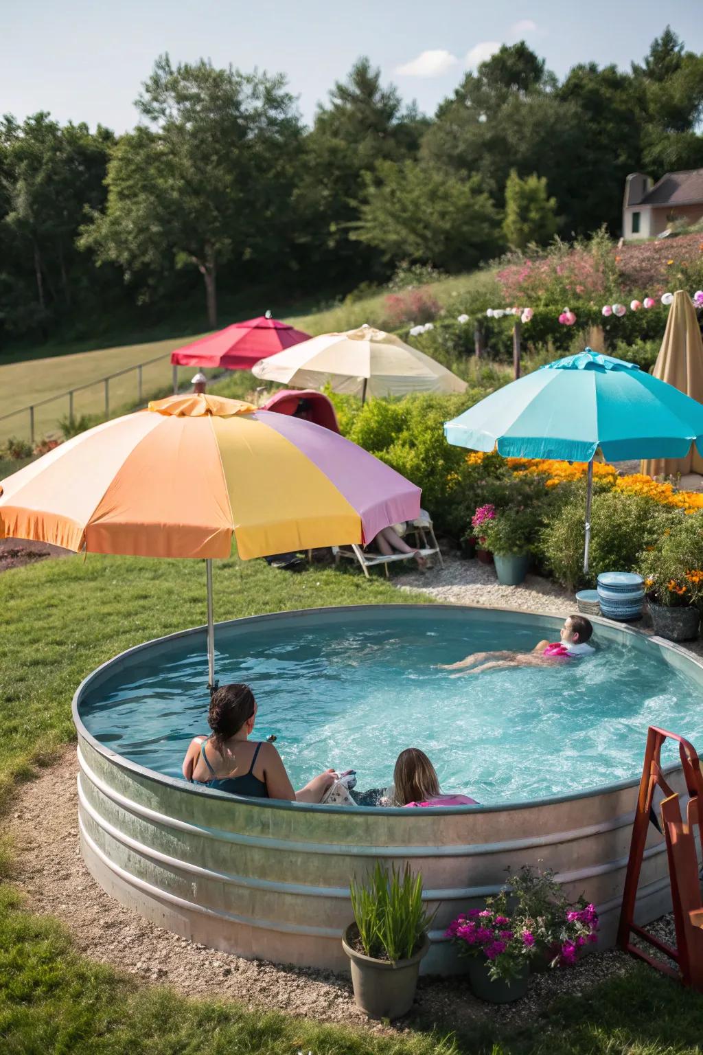 Chic umbrellas add a splash of color and shade to a stock tank pool.