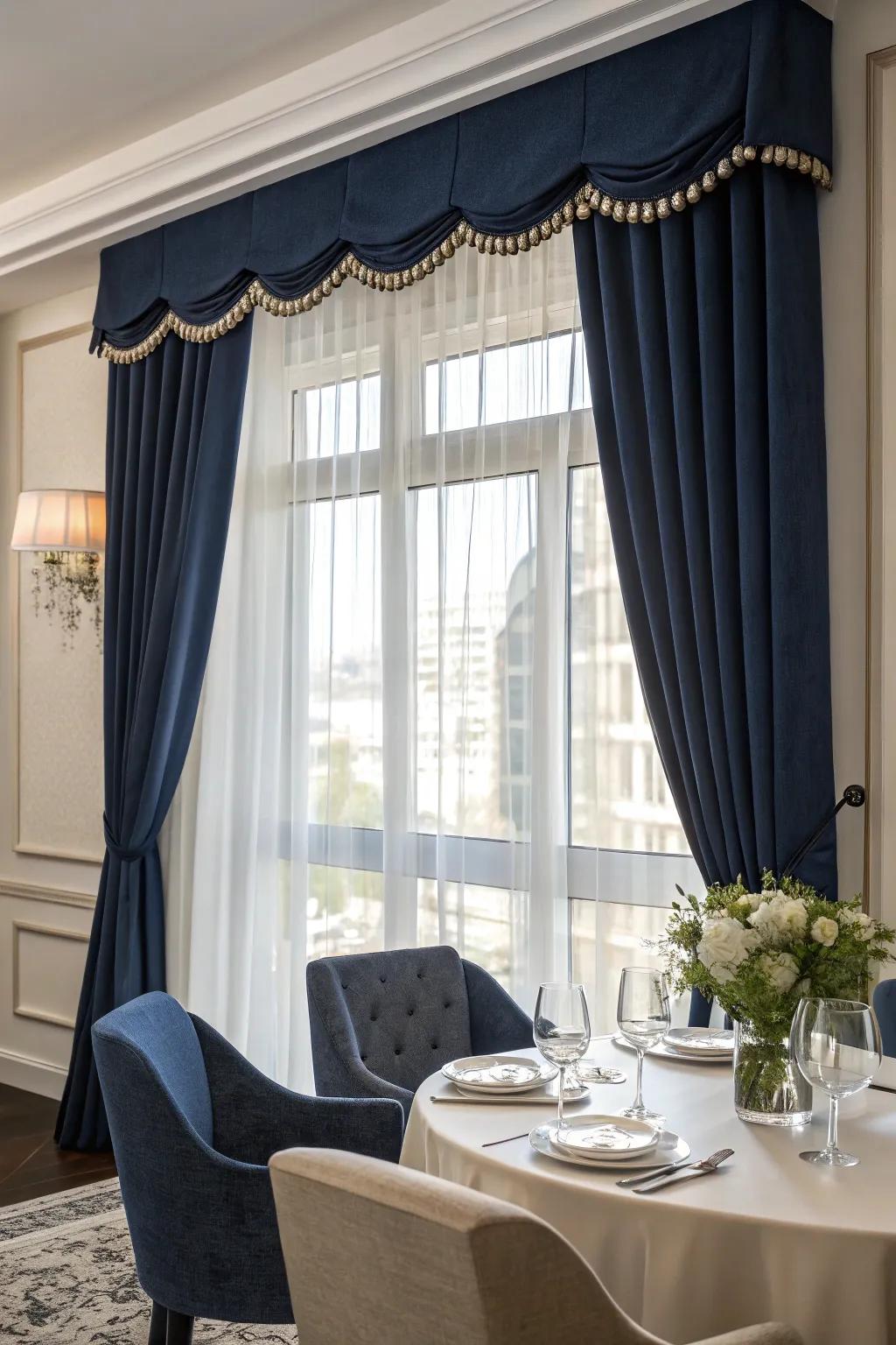 A window with a bold navy blue valance in a chic dining room.