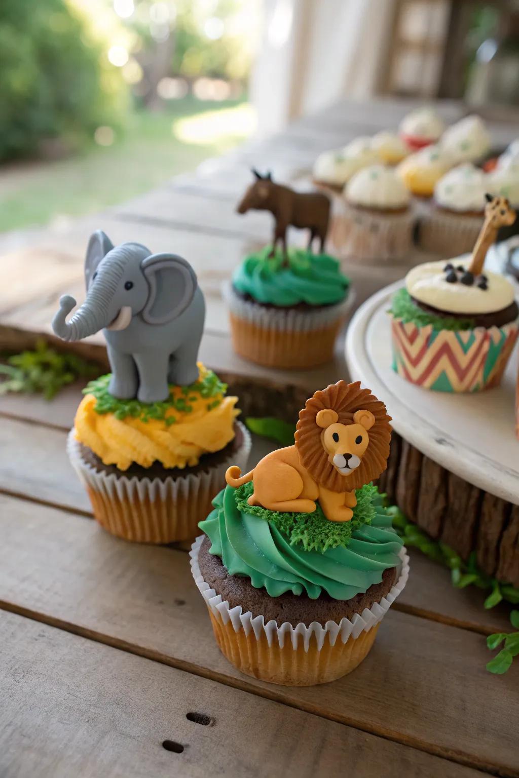 Safari animal-topped cupcakes introduce a playful adventure theme.