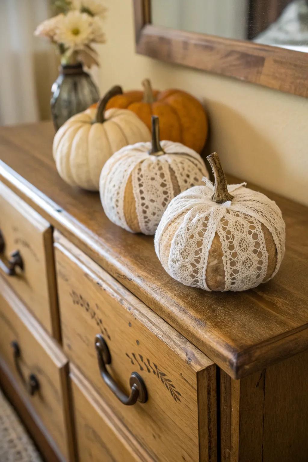 Lace-wrapped pumpkins exude vintage charm and elegance.