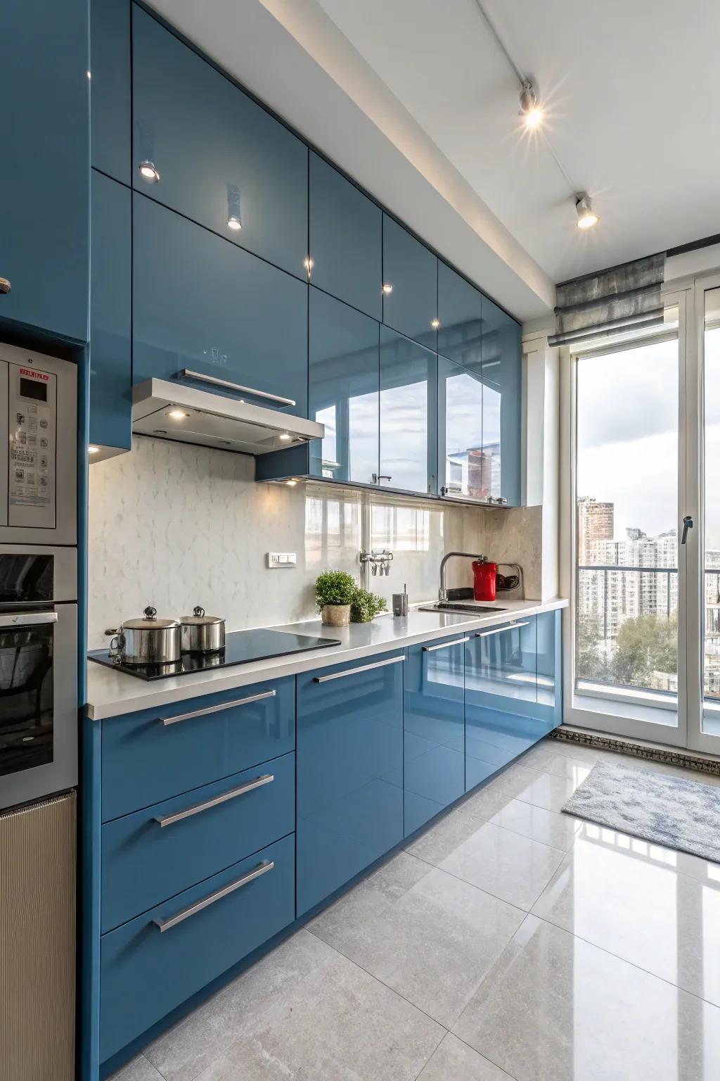 Glossy blue cabinets with minimalistic hardware offer a sleek and modern kitchen appearance.