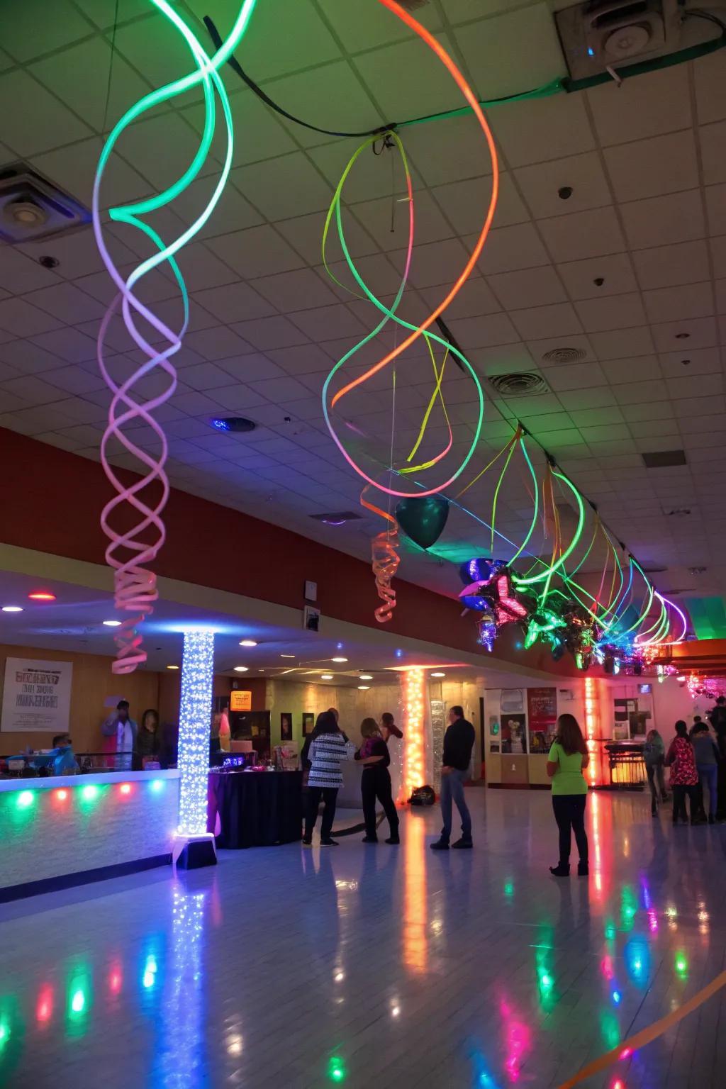 Hanging neon ribbons and strings creating a dynamic atmosphere in a glowing party room.