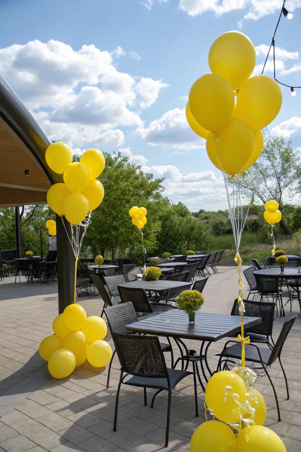 Vibrant yellow balloons in a garden setting.