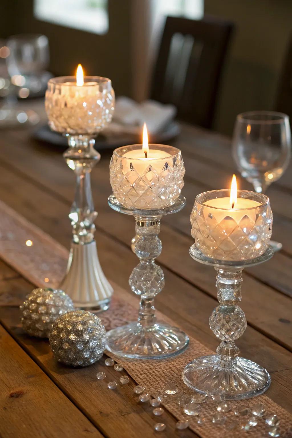 Crystal and glass candle holders reflecting candlelight elegantly.