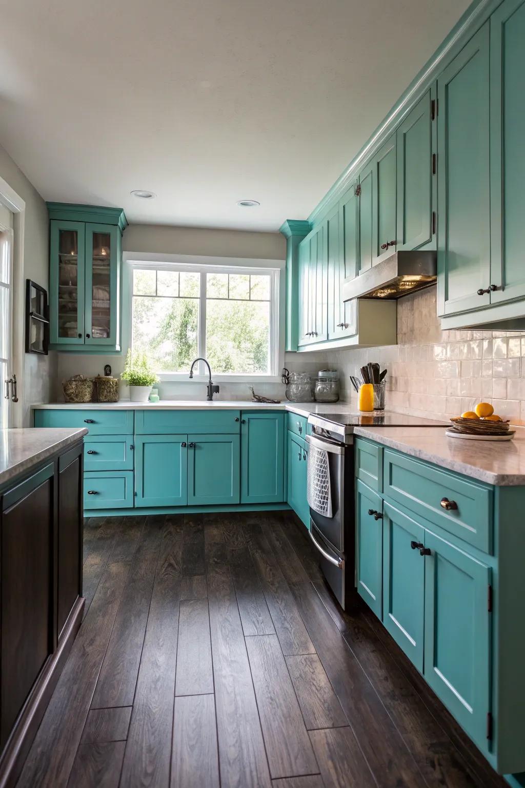 Dramatic dark floors complementing turquoise kitchen cabinets.