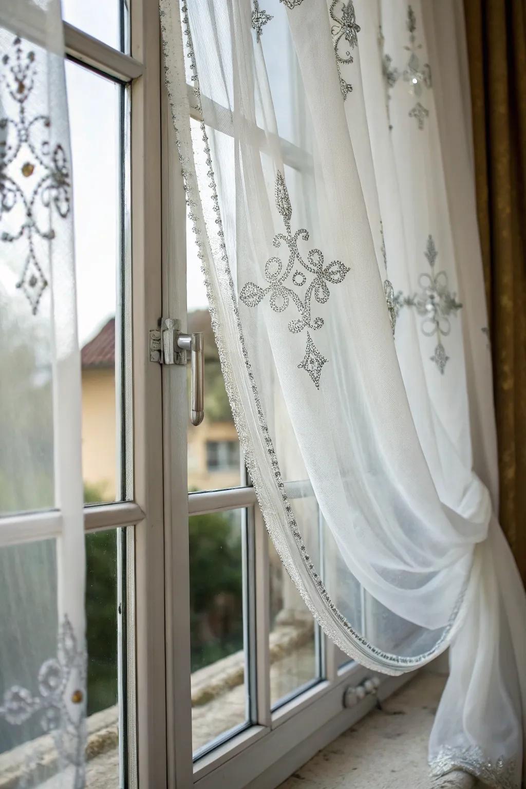 Brighten your space with sheer white curtains and silver details.