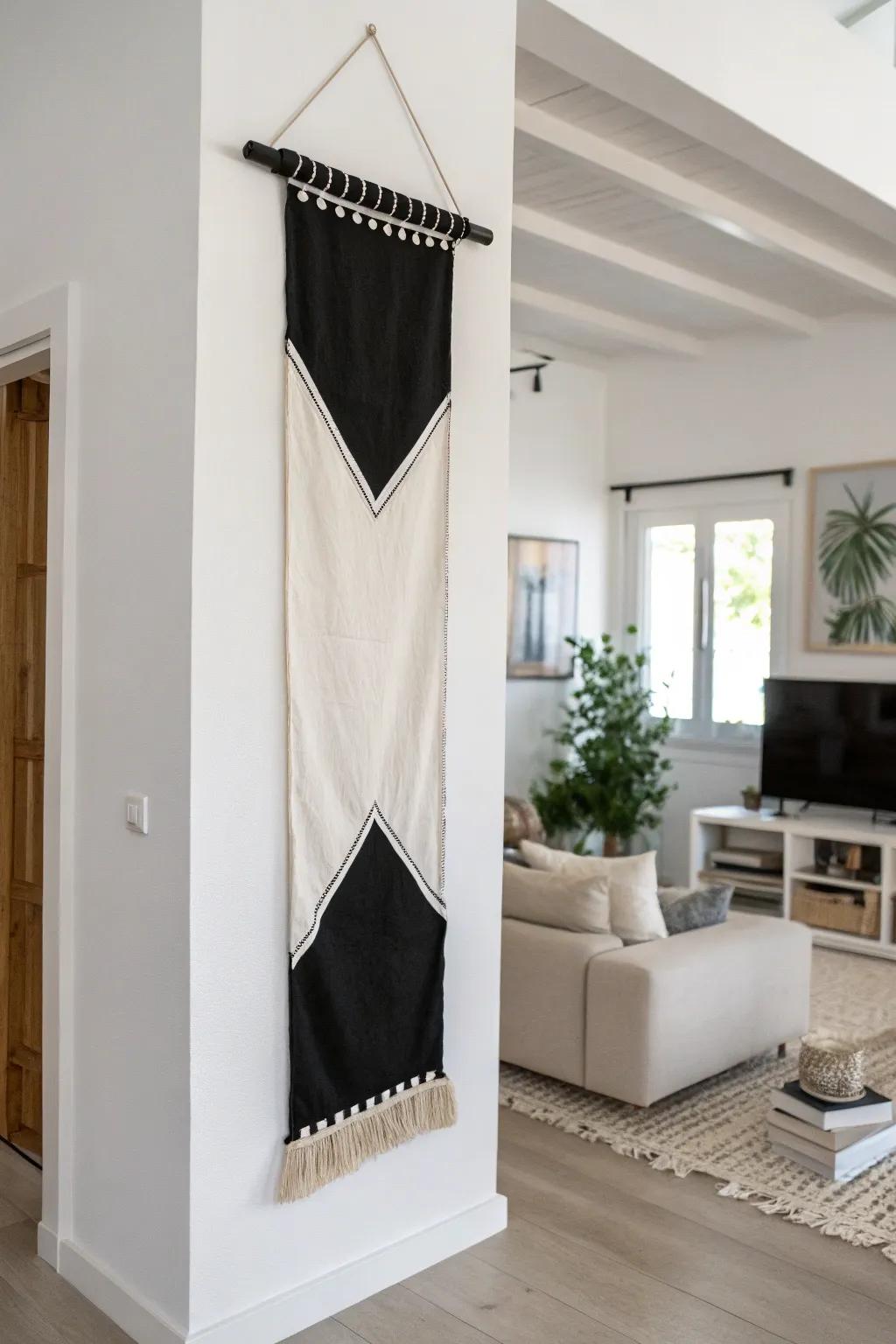 A black-and-white banner adds classic elegance to a minimalist space.